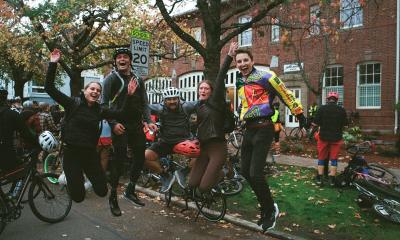 Cranksgiving participants leaping in the air