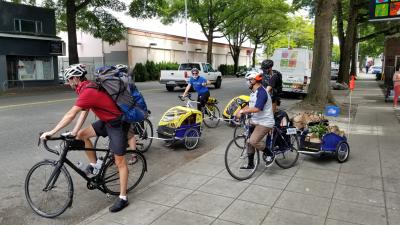 Cyclists with trailers full of food