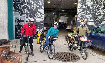 Three PRP volunteers outside the food bank