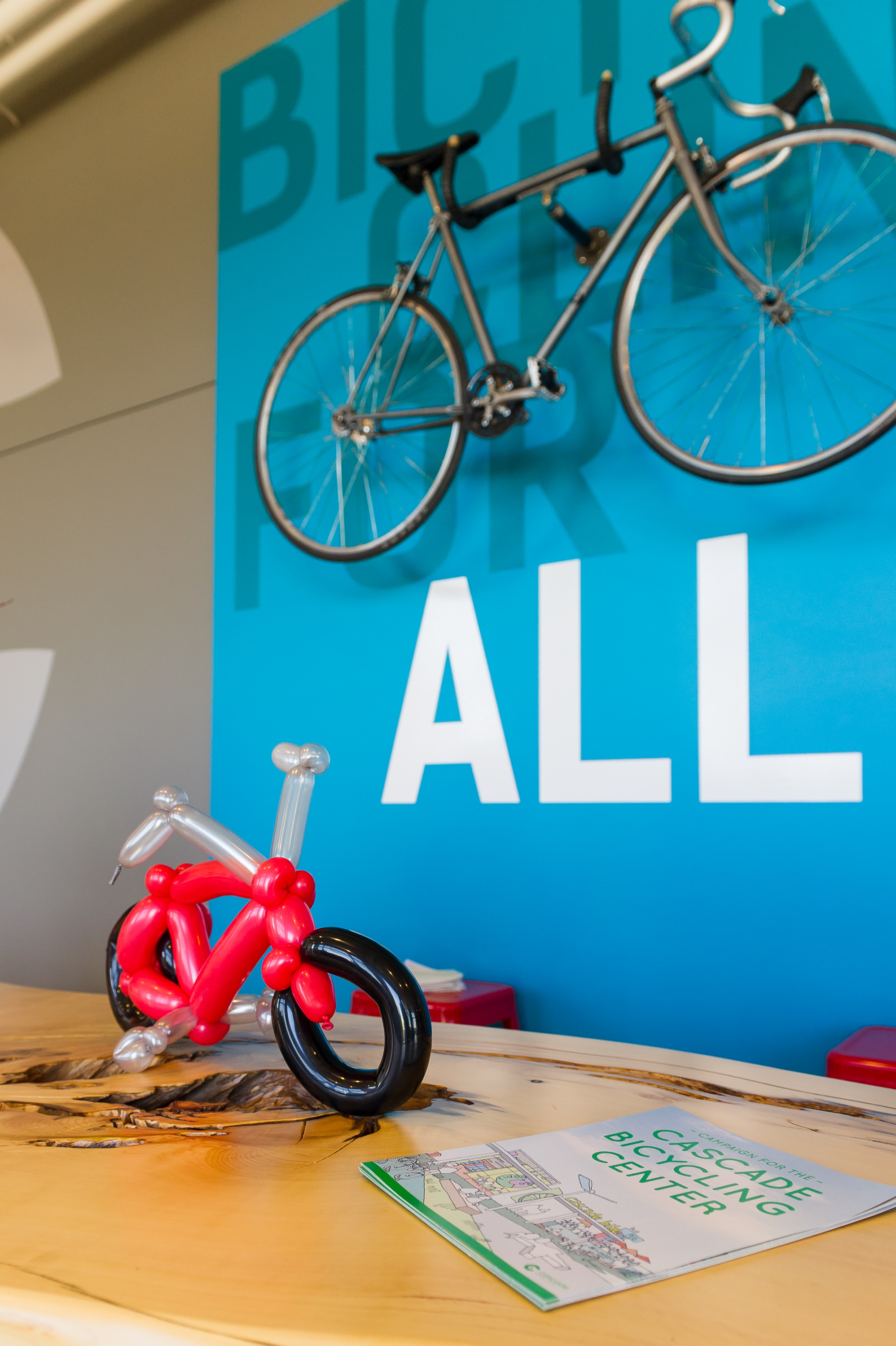 bicycle shaped balloons on a wooden table