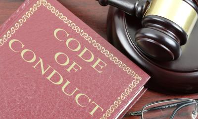 Code of conduct book and gavel