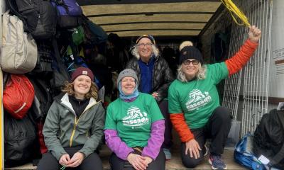 Volunteers and staff work at the bag truck for Chilly Hilly 2024.