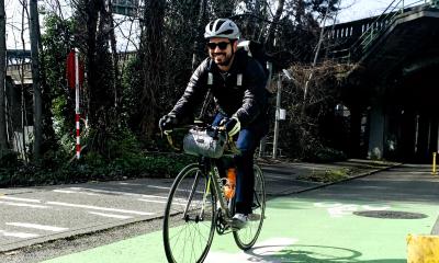 Tyler Vasquez riding in a protected bike lane