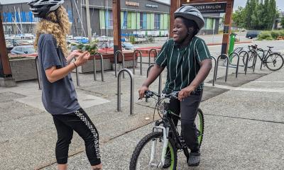 Erika teaches Bouba a Learn to Ride class