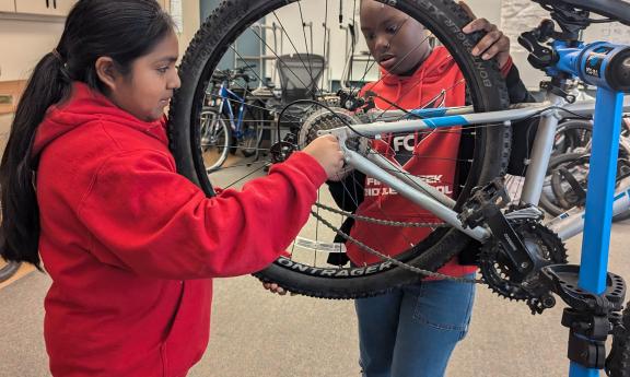 MTP youth participate in a bicycle maintenance exercise