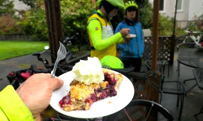 Cherry pie a la mode, with bicyclists in background