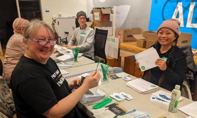 Four volunteers preparing race packets