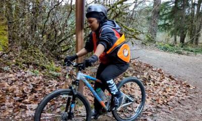 Lana Neely of Mount Tahoma High School's Major Taylor Project Club tries out mountain biking for the first time at Swan Creek Park