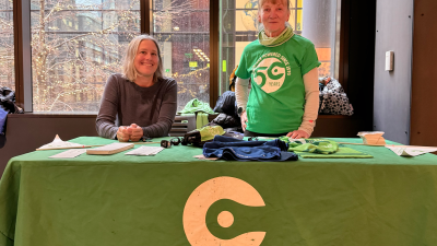 Two volunteers at a Cascade table