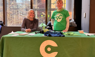 Two volunteers at a Cascade table