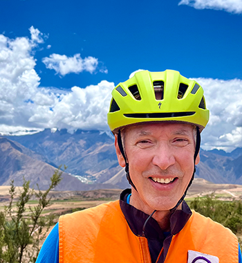 Demi Allen in Peru wearing a bike helmet and high vis vest