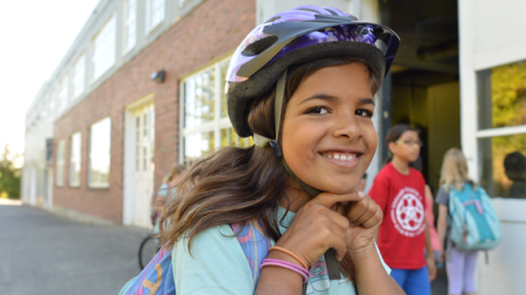 Girl with bike helmet