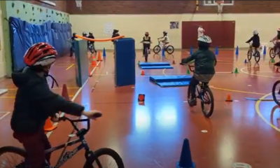 Kids navigating obstacle course on bikes