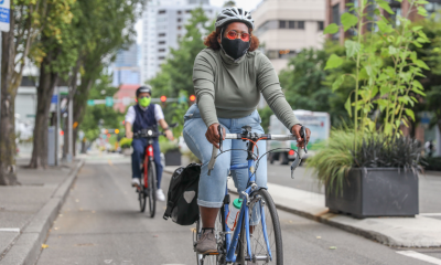 Cyclist riding in protected bike lane