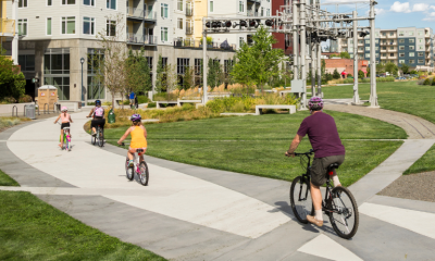 Cyclists riding in a city park trail